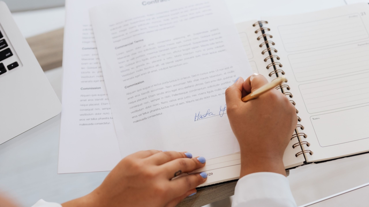checking and signing documents before buying a house from a developer
